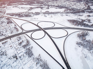 winter road junction in the countryside aerial view  in the form of butterfly