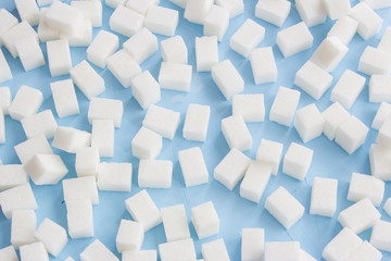 Sugar cubes on a blue background