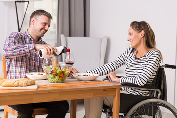 Man and women on wheelchair during meal