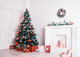 Beautiful new year room with decorated Christmas tree, gifts and fireplace. The idea for postcards. Soft focus. Shallow DOF