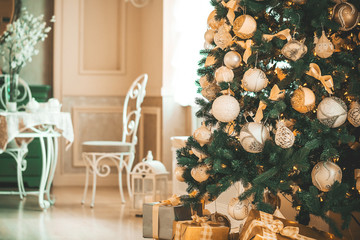 Beautiful background Living new year room with decorated Christmas tree and gifts.  The idea for postcards. Soft focus. Shallow DOF
