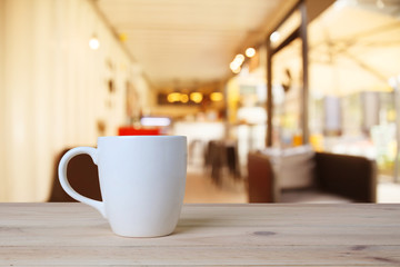 A cup of coffee on table in cafe.