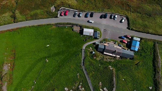 Aerial view of the cars parked in Dingle Ireland found on the top of a mountain from the SkyRoad in Ireland