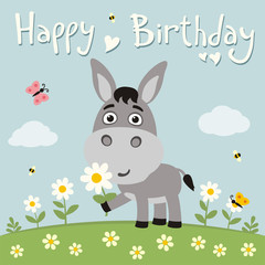 Obraz na płótnie Canvas Happy birthday! Cute donkey with flower on meadow. Birthday card.