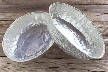 Aluminum foil cup for bakery cake on wooden background