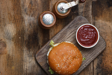 Sandwich hamburger with juicy burgers, cheese and mix of cabbage. Top view