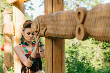 Young beautiful amazon girl hunting in the forest