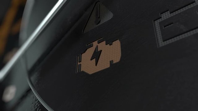 An extreme closeup of a blinking check engine dashboard light on an dashboard panel background