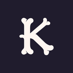 K letter logo made out of bones.