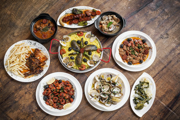 mixed portuguese traditional rustic tapas food selection on wood