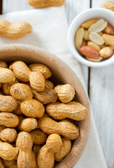 peanuts on wooden surface