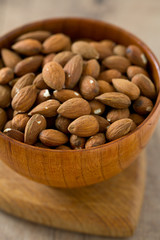 almonds on wooden surface