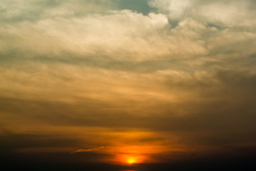 Naklejka na ściany i meble Nice clouds with sunset in sky