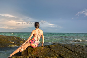 Lonely girl looking at the horizon
