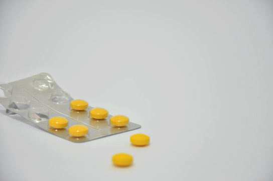 Yellow medicinal pills.