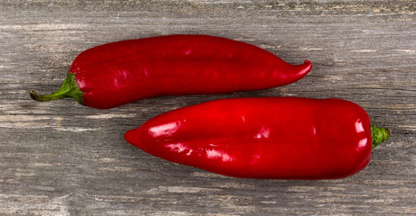 Red pepper on grey board background/Vertical close-up of red pepper