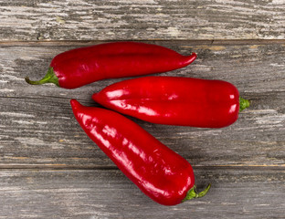 Red pepper on grey board background/Vertical close-up of red pepper