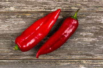 Red pepper on grey board background/Vertical close-up of red pepper
