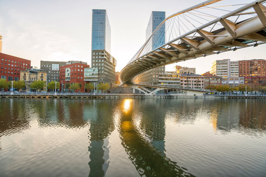 modern bilbao buildings at riverbank