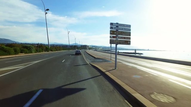Driving along road in southern France, between Antibes and Nice