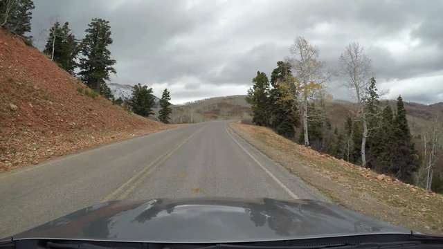 Scenic snow mountain Mnt Nebo drive POV windo. Beauty seasonal Autumn colors exploring high mountain roads and trails. Point of view, POV high mountain valley. Fall colors, beautiful nature. Outdoors.