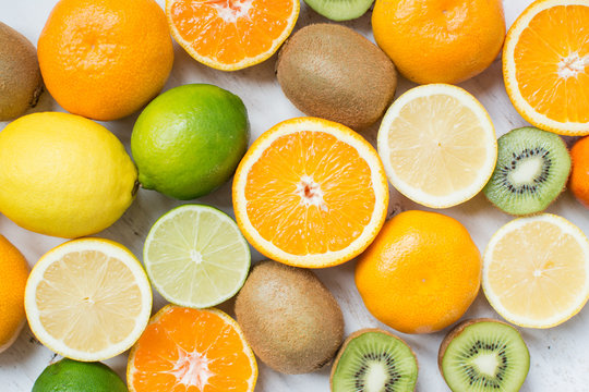 Fruits Rich In Vitamin C: Oranges, Lemons, Limes, Clementines, Kiwis, Top View, Selective Focus