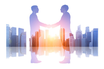 Double exposure business people shaking hands over a cityscape background