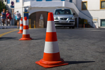 Traffic cone for traffic control. Focus on the foreground.