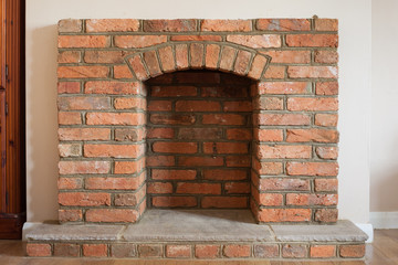 Indoor DIY project: building fireplace in the house: finishing touches, selective focus