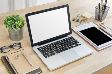 laptop mockup with elements on wooden table