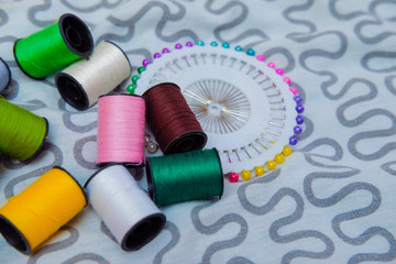 Colorful thread spools. Sewing kit. yarn color