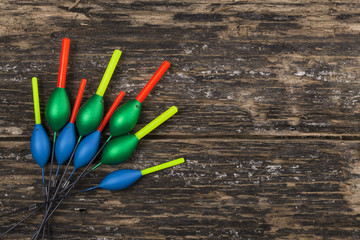 Fishing floats on wooden background © Elena Milevska