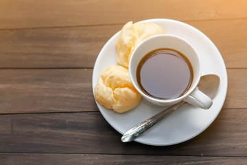 cup of coffee on the wooden table