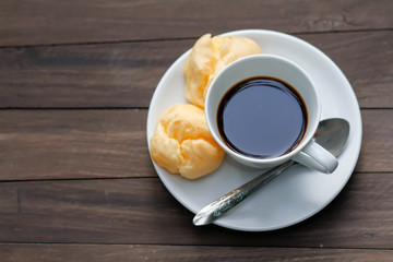cup of coffee on the wooden table
