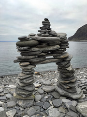 Pyramid of pebbles on the Barents Sea beach in Norway