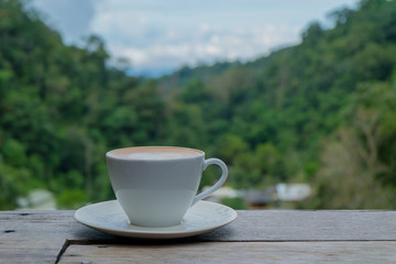 Hot coffee on the wood.