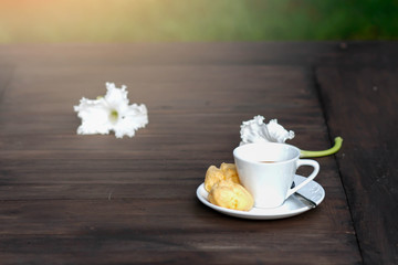 cup of coffee on the wooden table