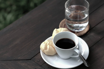 cup of coffee on the wooden table