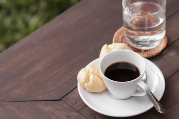 cup of coffee on the wooden table