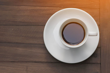 cup of coffee on the wooden table