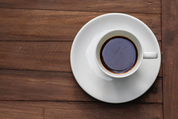 cup of coffee on the wooden table