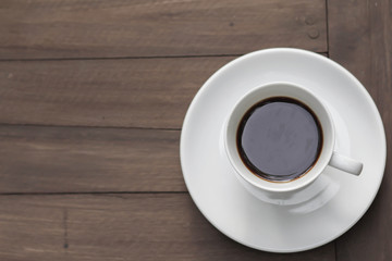 cup of coffee on the wooden table