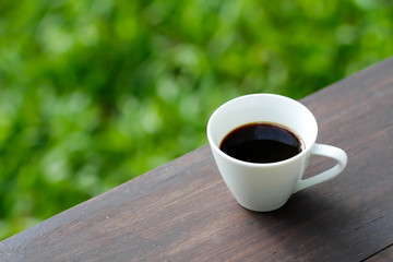 cup of coffee on the wooden table