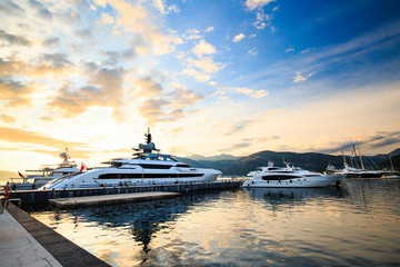 Fototapeta na wymiar Luxury yacht marina. Port in Mediterranean sea at sunset.