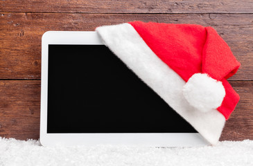 Obraz na płótnie Canvas Christmas decoration and a tablet with copy space
