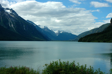Scenic View of Snowcapped Coastal Mountains Under a Cloudy Sky Near Haines Alaska