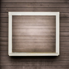 White frame on the grunge wooden plank wall