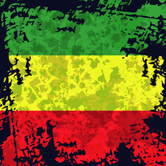 Green, yellow, red rasta flag. Rastafarianism grunge background. Colorful backdrop for decoration work in reggae, rastaman festivals, posters, promotional items.