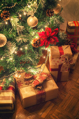 Fototapeta na wymiar Christmas gifts in front of Christmas tree