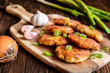 Fried tuna pancakes with potato, onion and garlic